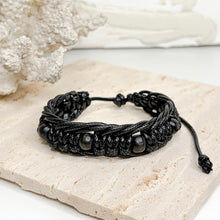 Load image into Gallery viewer, Unisex adjustable macramé bracelet with wooden beads in black and brown woven cord design