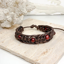 Load image into Gallery viewer, Unisex adjustable macramé bracelet with wooden beads in black and brown woven cord design
