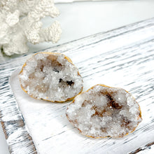 Load image into Gallery viewer, CLEAR QUARTZ CUT GEODE PAIR
