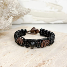 Load image into Gallery viewer, Unisex adjustable macramé bracelet with wooden beads in black and brown woven cord design
