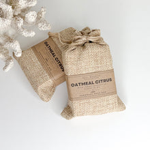 Load image into Gallery viewer, Handcrafted oatmeal citrus soap bar with lemon eucalyptus essential oil and chamomile flowers
