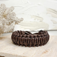 Load image into Gallery viewer, Unisex adjustable macramé bracelet with wooden beads in black and brown woven cord design
